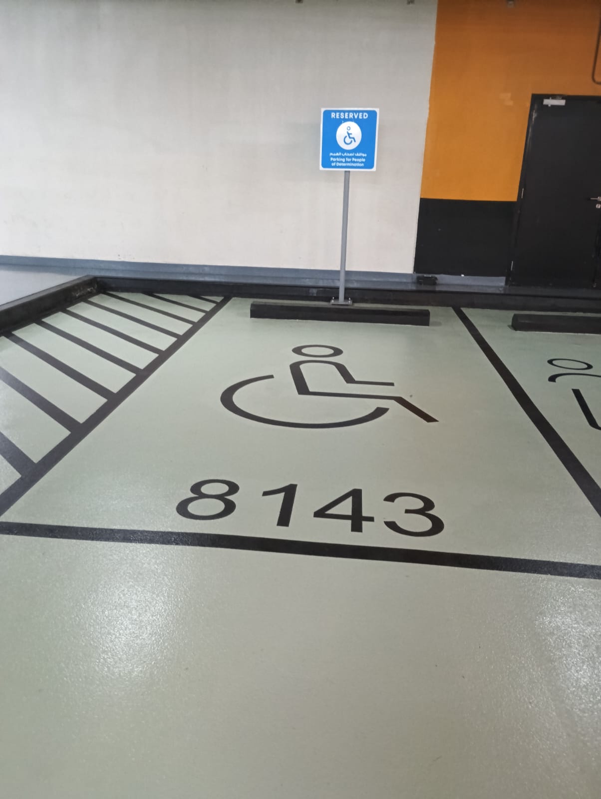 Management Building designated parking for people of determination