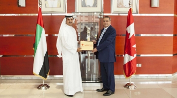 with the hopes of encouraging them to make the transition to Canada to further their studies and development. Dr. Alaa -El- Aziz, President and Vice Chancellor of the University of Prince Edward Island receiving an Award from Mr. Buti Saeed El Gandi