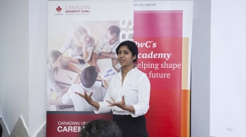 Ms. Amanda Abraham of PWC speaking to our students